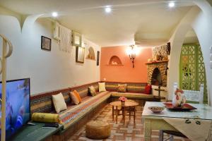 a living room with a couch and a table at Casa della Favola Boutique Hotel in Chania Town