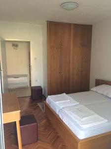 Кровать или кровати в номере Apartmani Focic