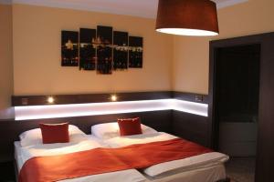 Posteľ alebo postele v izbe v ubytovaní Hotel Uno