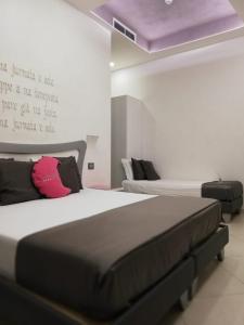 Postel nebo postele na pokoji v ubytování Hotel Nunù