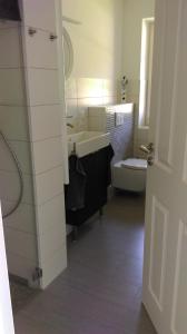 a bathroom with a sink and a toilet at Ferienwohnung Böttcher in Putbus