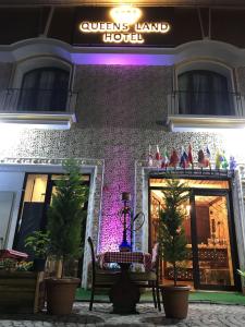 a building with a sign that reads queensland hotel at Hotel Queens Land in Istanbul