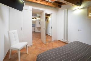TV a/nebo společenská místnost v ubytování Alkimia Smart Rooms