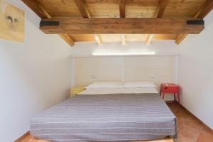 Postel nebo postele na pokoji v ubytování Alkimia Smart Rooms