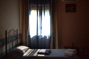 Postel nebo postele na pokoji v ubytování B&B Armonia
