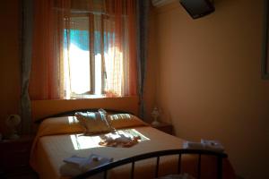 Postel nebo postele na pokoji v ubytování B&B Armonia