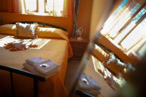 Postel nebo postele na pokoji v ubytování B&B Armonia