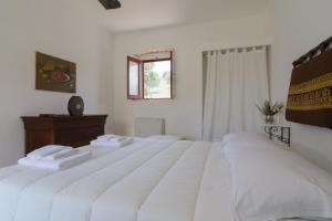 Postel nebo postele na pokoji v ubytování Agriturismo di Serragiumenta