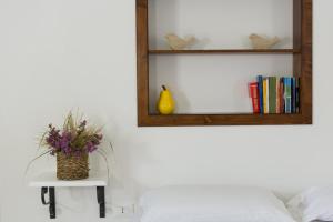 Postel nebo postele na pokoji v ubytování Agriturismo di Serragiumenta
