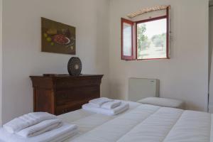 Postel nebo postele na pokoji v ubytování Agriturismo di Serragiumenta