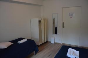 Postel nebo postele na pokoji v ubytování Hostel Tikka