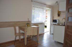 Kuchyň nebo kuchyňský kout v ubytování Apartamenty i pokoje u Kryni