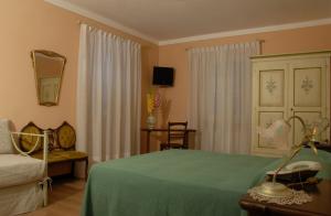 A bed or beds in a room at B&B Le Camelie