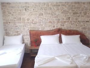 Postel nebo postele na pokoji v ubytování Hotel Omer