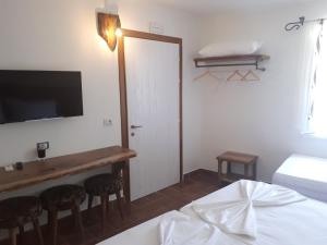 Postel nebo postele na pokoji v ubytování Hotel Omer