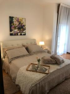 Кровать или кровати в номере Casa Martini Abano