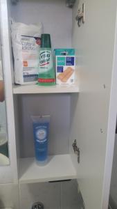 a bathroom cabinet with some items on it at Be Lake Apartment in Baveno