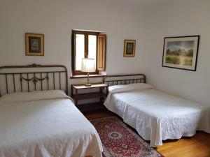 En eller flere senge i et værelse på Casa Rural San Pelayo