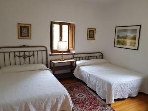 Postel nebo postele na pokoji v ubytování Casa Rural San Pelayo
