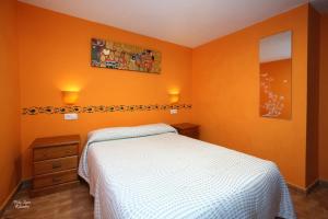 Postel nebo postele na pokoji v ubytování Apartamentos Bouso