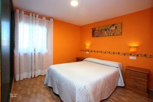 Postel nebo postele na pokoji v ubytování Apartamentos Bouso