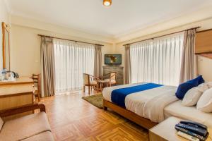 Postel nebo postele na pokoji v ubytování Hotel White Pearl