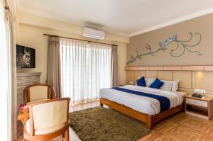 Postel nebo postele na pokoji v ubytování Hotel White Pearl