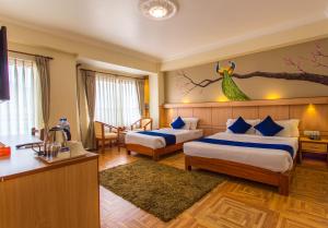 Postel nebo postele na pokoji v ubytování Hotel White Pearl
