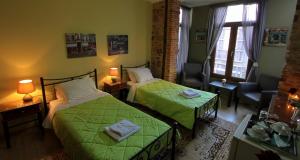 A bed or beds in a room at Ionia rooms