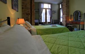 A bed or beds in a room at Ionia rooms