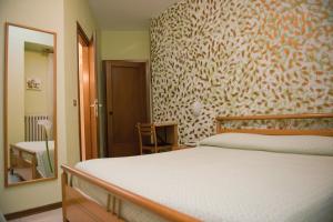 Letto o letti in una camera di Hotel Centrale di Paolo e Cinzia