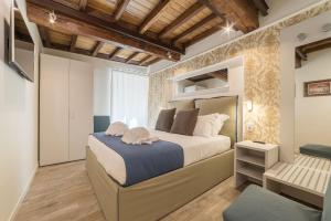 Een bed of bedden in een kamer bij CS Exclusive Campo de Fiori Palace