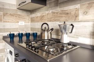 A kitchen or kitchenette at Traveller’s Home in Gourmet District Near Center!