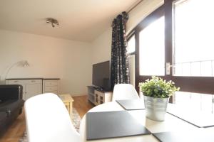 a living room with a couch and a table at Marina Humber View Apartment in Hull