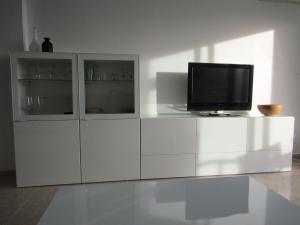 A television and/or entertainment centre at Duplex appartement Arabella