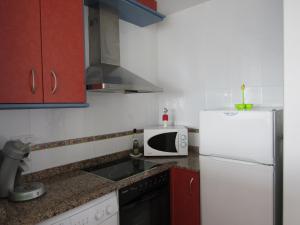 A kitchen or kitchenette at Duplex appartement Arabella