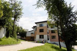 a building with people standing outside of it at Carla's apartment -shuttle in Iaşi