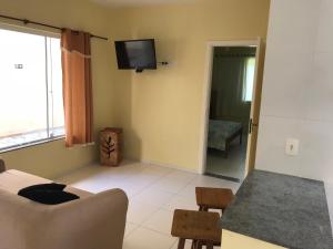 TV in/ali zabaviščno središče v nastanitvi Mar e Lua Flats - Maresias
