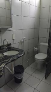 a bathroom with a sink and a toilet at Casa de Nylva Beach Pipa in Pipa