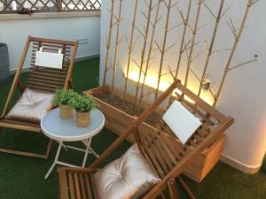 a room with chairs and a table and a tree at Dimore di Mare in San Pietro Vernotico