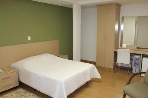 
Cama ou camas em um quarto em Hotel Colonial Gold
