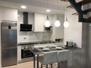 A kitchen or kitchenette at Loft Duplex Malaga