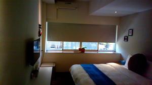 Postel nebo postele na pokoji v ubytování 237 Hotel