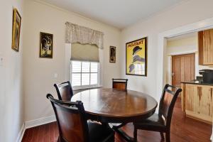 a dining room with a wooden table and chairs at New Orleans Cottage in New Orleans