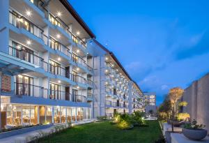 an exterior view of a building at night at Eastin Ashta Resort Canggu in Canggu