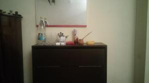 a black dresser in a corner of a room at Къща за гости Пеневи in Sofia +25 photos