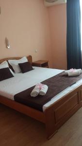 Postel nebo postele na pokoji v ubytování Dreams Family Hotel