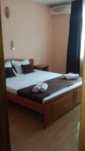 Postel nebo postele na pokoji v ubytování Dreams Family Hotel