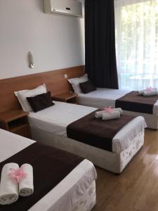 Postel nebo postele na pokoji v ubytování Dreams Family Hotel