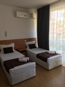 Postel nebo postele na pokoji v ubytování Dreams Family Hotel